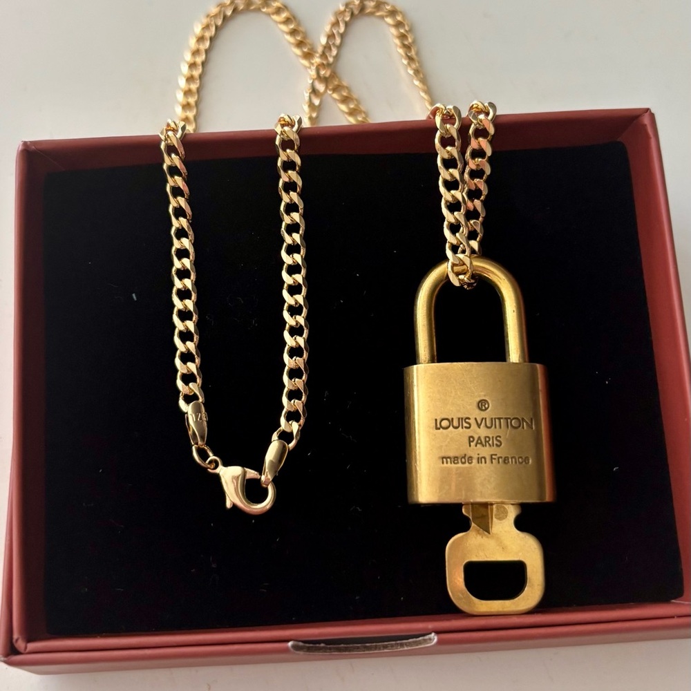 Louis Vuitton Gold Padlock w/necklace!